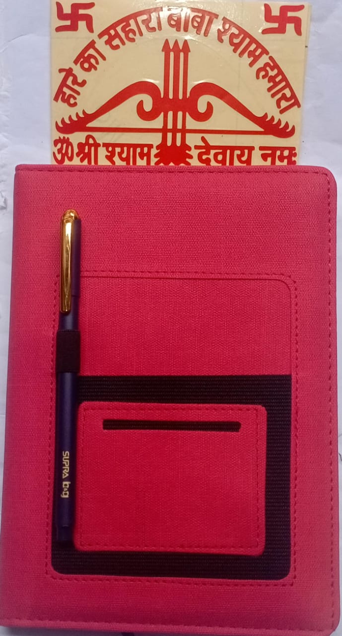 Red notebook with a pen and card holder, featuring a religious symbol on a white background.