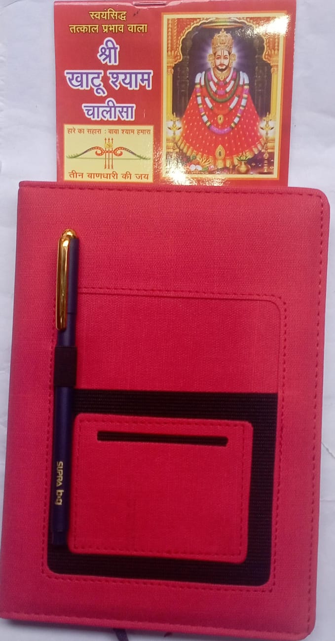 Red notebook with pen and cover featuring an image of a deity on a white background