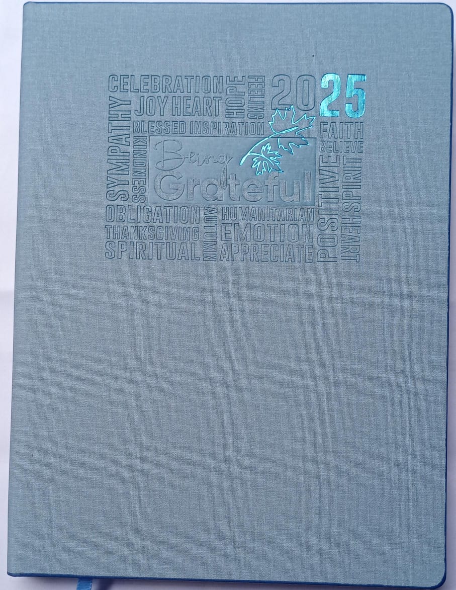 Blue notebook with embossed text and design on a white background
