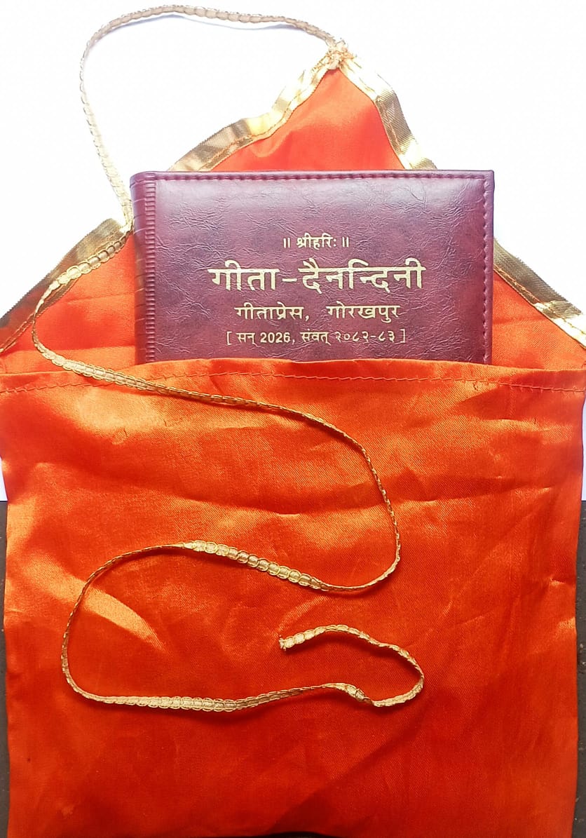 Purple book with gold text on an orange fabric background