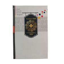 Book with a black and gold emblem on a white background