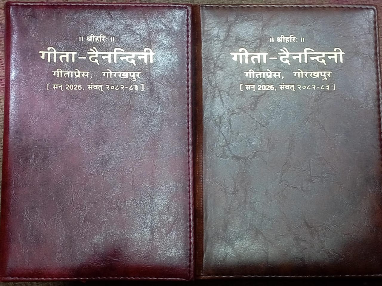 Two leather-bound books with text on a dark background