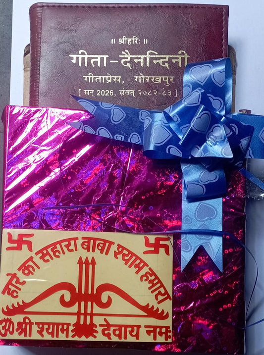 Gift wrapped in pink paper with a blue bow, placed on a surface.