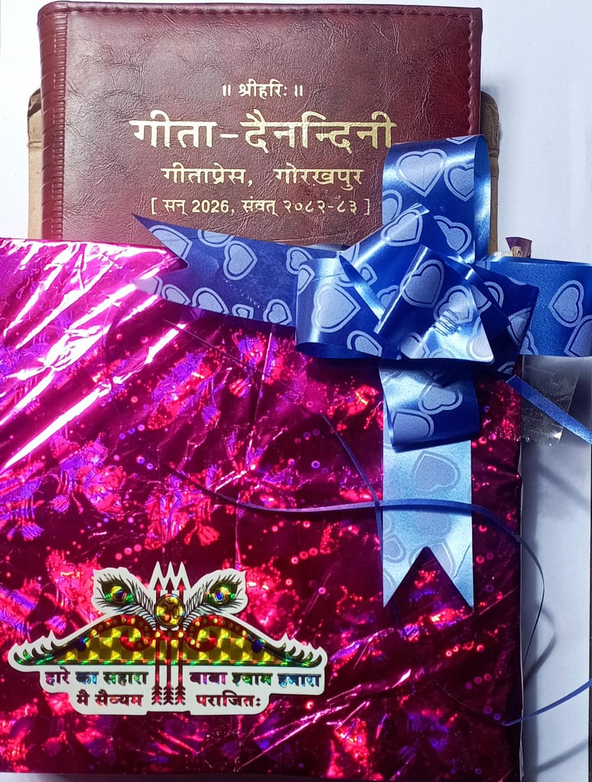 Gift wrapped in red paper with a blue bow, placed on a white surface.