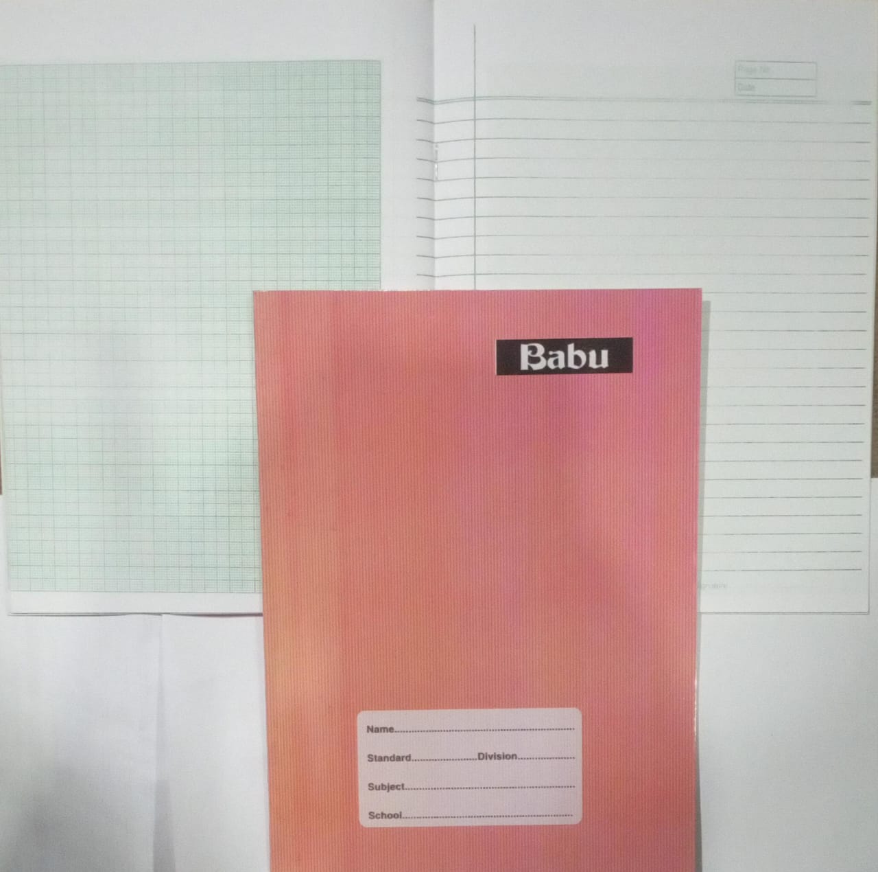 Pink notebook with 'Babu' branding on a white background