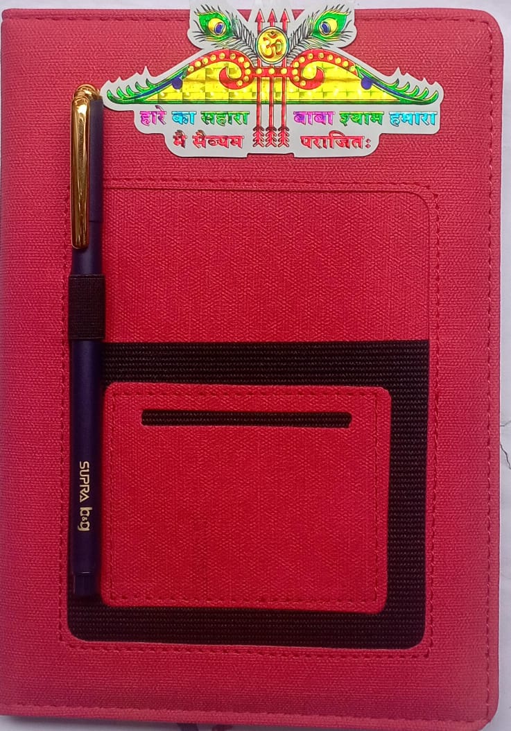 Red notebook with a pen and card holder on a red background