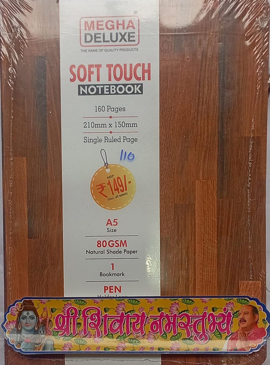 Megha Deluxe soft touch notebook packaging on a wooden surface with decorative text at the bottom.