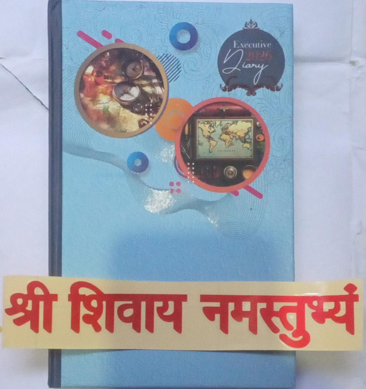 Blue diary with decorative elements on a white background